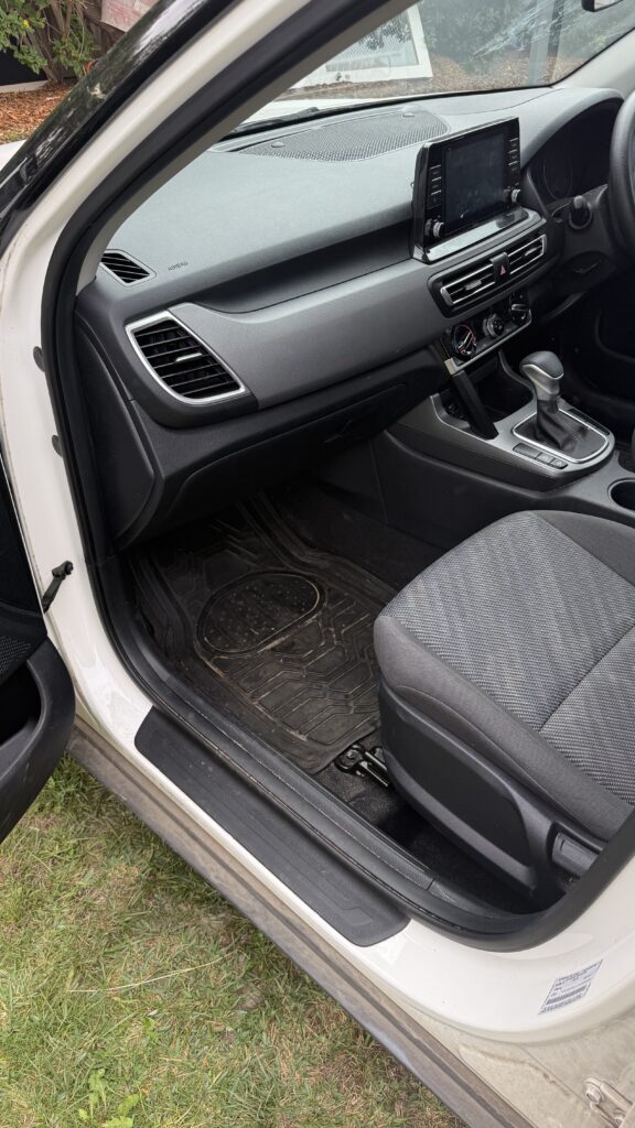 Kia interior photographed before detailing.