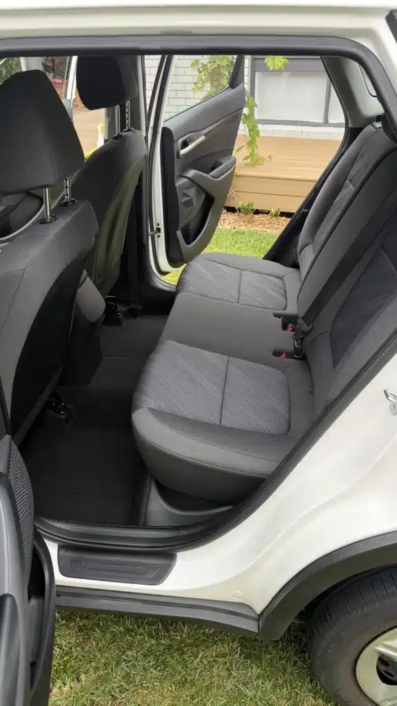 Matching Kia rear seat upholstery after interior cleaning.