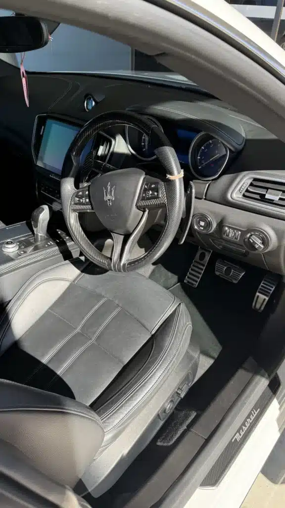 Maserati driver seat and cockpit after a maintenance detail.