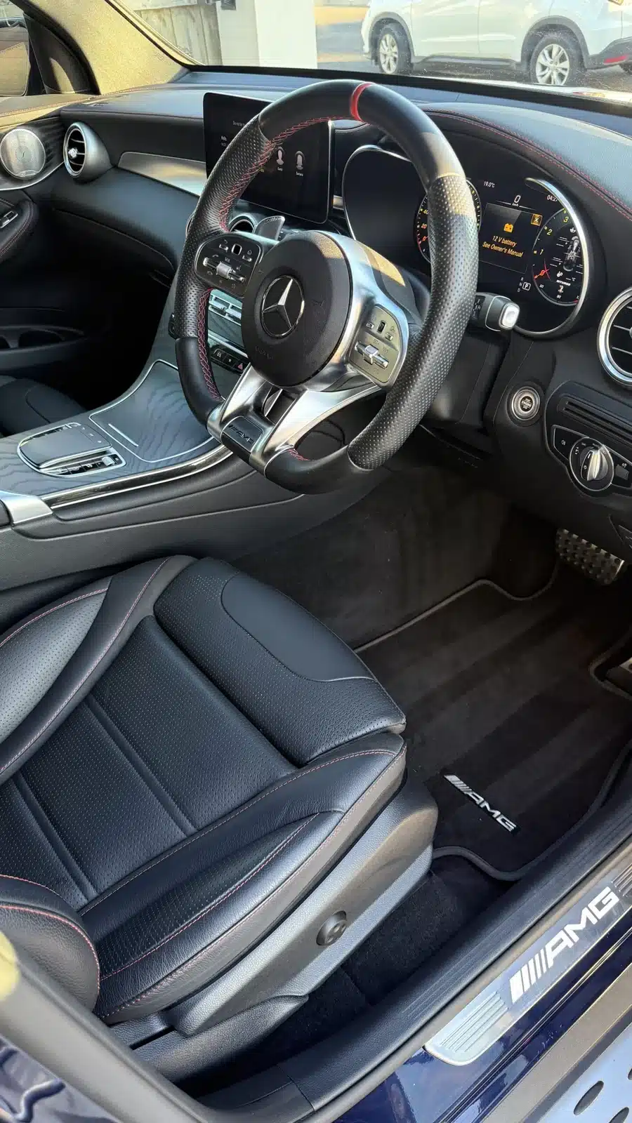 Clean black Mercedes driver seat and cabin after a full detail.